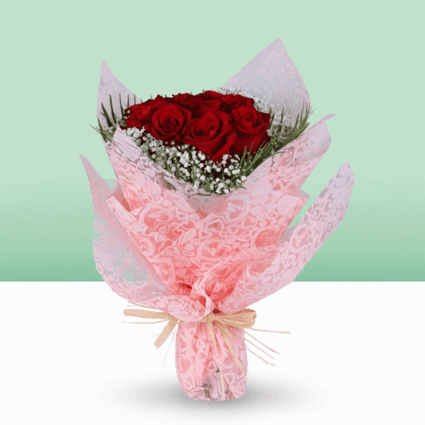 Fresh red roses with soft gypso accents, wrapped in non-woven paper and finished with a golden "Love You" topper