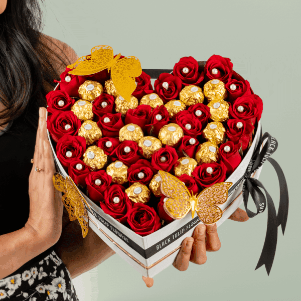 White heart-shaped flower box with 35 red roses, Valentine topper, and 20 Ferrero Rocher chocolates