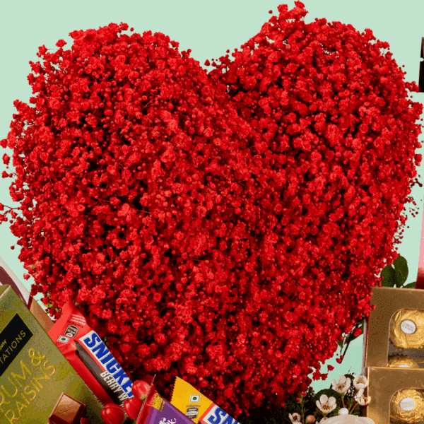 Box of red roses with 15 exotic chocolates arranged neatly in a rectangle basket with a bow tied.
