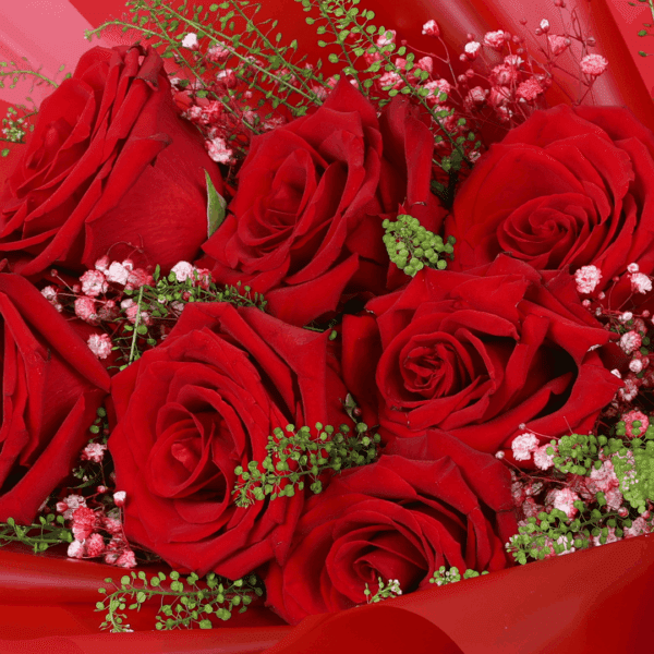 "Fifty red roses arranged elegantly, wrapped in Korean-style flower sheets and topped with a “Love You” sign"