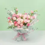 An exquisite bouquet of 30–35 stems of assorted roses, sweet eustoma, and fresh eucalyptus, wrapped beautifully in Korean-style white paper.