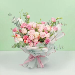 An exquisite bouquet of 30–35 stems of assorted roses, sweet eustoma, and fresh eucalyptus, wrapped beautifully in Korean-style white paper.