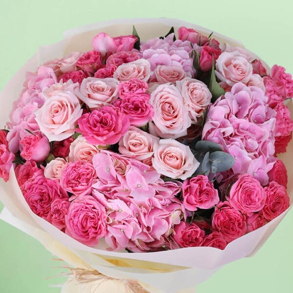 Premium pink dual flower bouquet featuring lush hydrangeas and classic roses arranged in a graceful floral design