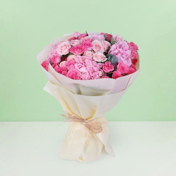 Premium pink dual flower bouquet featuring lush hydrangeas and classic roses arranged in a graceful floral design