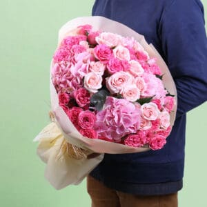 Premium pink dual flower bouquet featuring lush hydrangeas and classic roses arranged in a graceful floral design