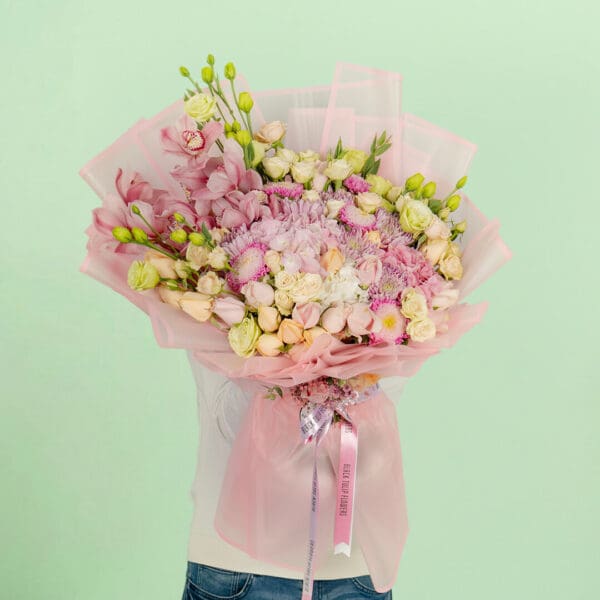 Designer flower bouquet featuring 40–50 premium stems of assorted blooms, wrapped in luxury Korean-style paper and tied with a satin ribbon.