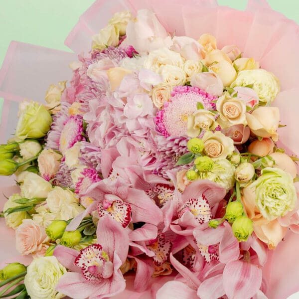Designer flower bouquet featuring 40–50 premium stems of assorted blooms, wrapped in luxury Korean-style paper and tied with a satin ribbon.