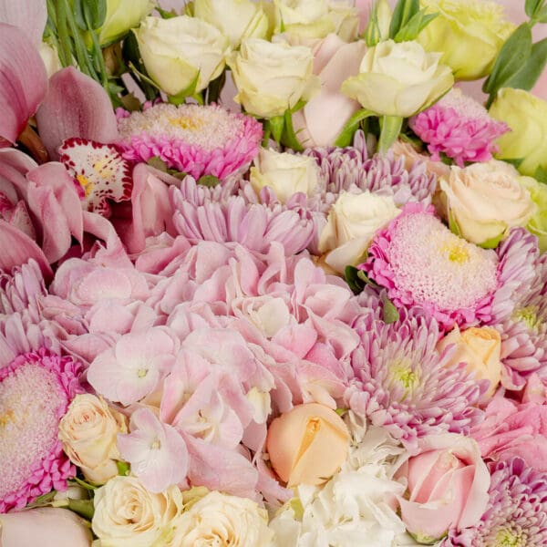 Designer flower bouquet featuring 40–50 premium stems of assorted blooms, wrapped in luxury Korean-style paper and tied with a satin ribbon.