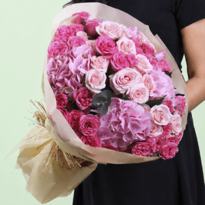Premium pink dual flower bouquet featuring lush hydrangeas and classic roses arranged in a graceful floral design